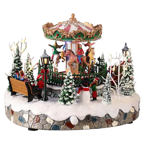 Carrousel de Noël avec animaux illuminé en mouvement 20x20x15 cm